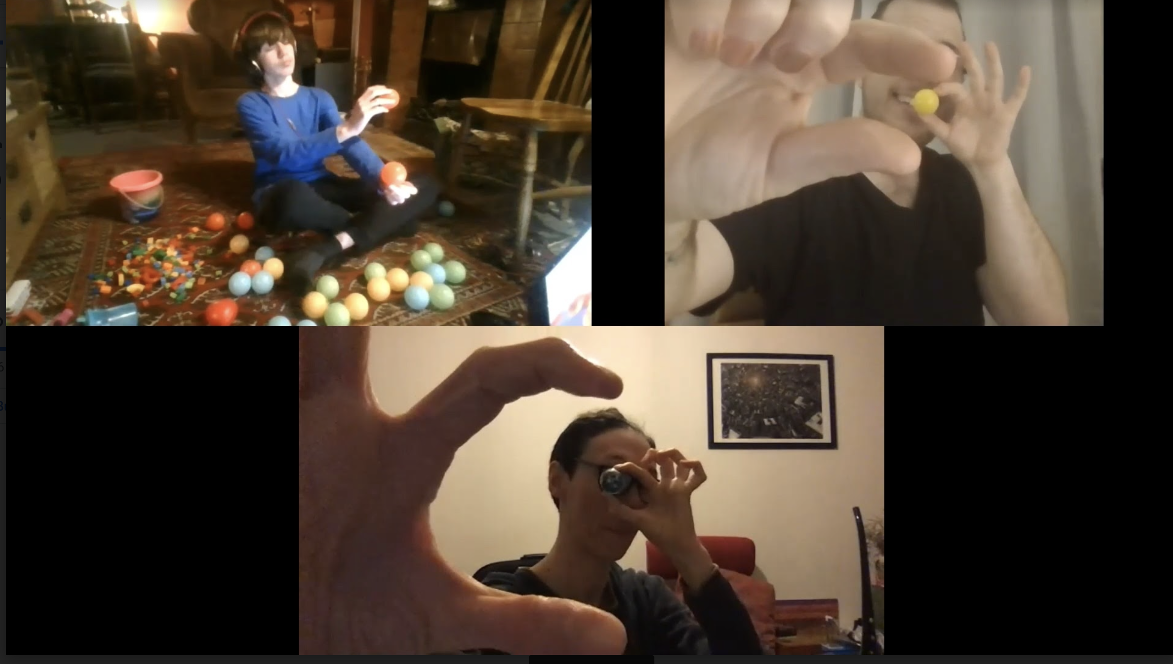 Zoom screen with 3 participants, including a young person sat on a rug surrounded by different colour and shaped plastic balls and holding two orange balls. The other participants are also holding up one plastic ball to their eye and holding their other hand up close to the camera in a C shape.