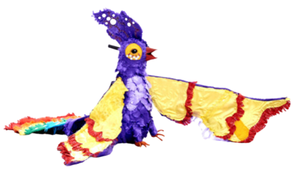 Photo of Fred the Nightingale Parrot puppet. Fred's body is purple, with a crest of purple feathers on his head decorated with circular mirrors. The underside of his wings is yellow with red trim. He has yellow circles with red detailing around his eyes and a red beak. He has a big tail of multi-coloured feathers.